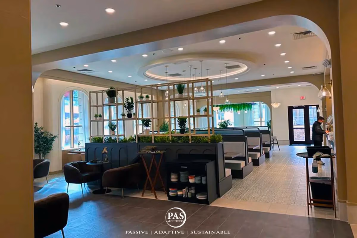 Interior restaurant renovation featuring open dining layout with soft ambient lighting at Sugo Social