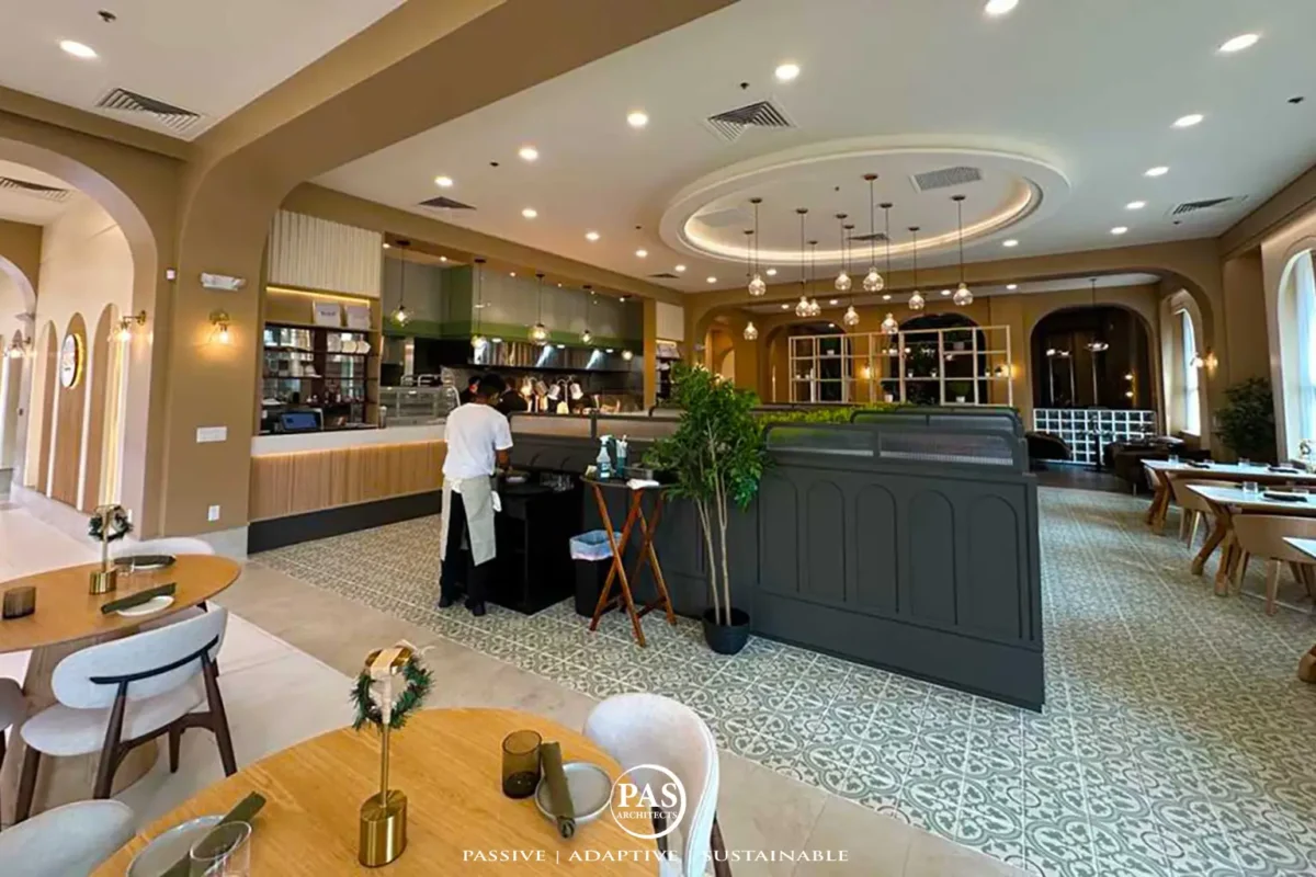 Lounge space with dark tile flooring and warm ambient lighting in Sugo Social restaurant remodel